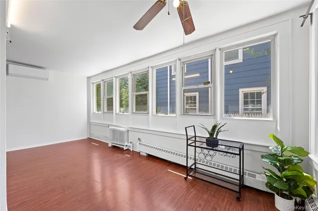 a view of a house with wooden floor and windows