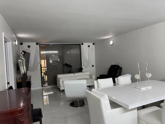 a bathroom with a granite countertop sink a toilet and bathtub