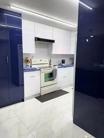 a bathroom with a sink a toilet a mirror and shower