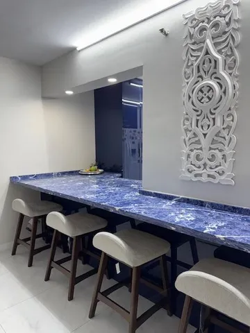 a view of a patio with table and chairs potted plants and large trees