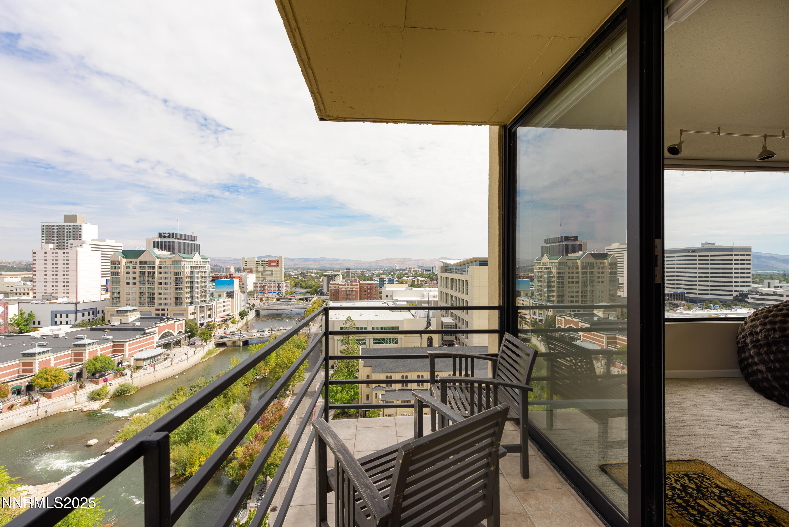 a view of a balcony with city view