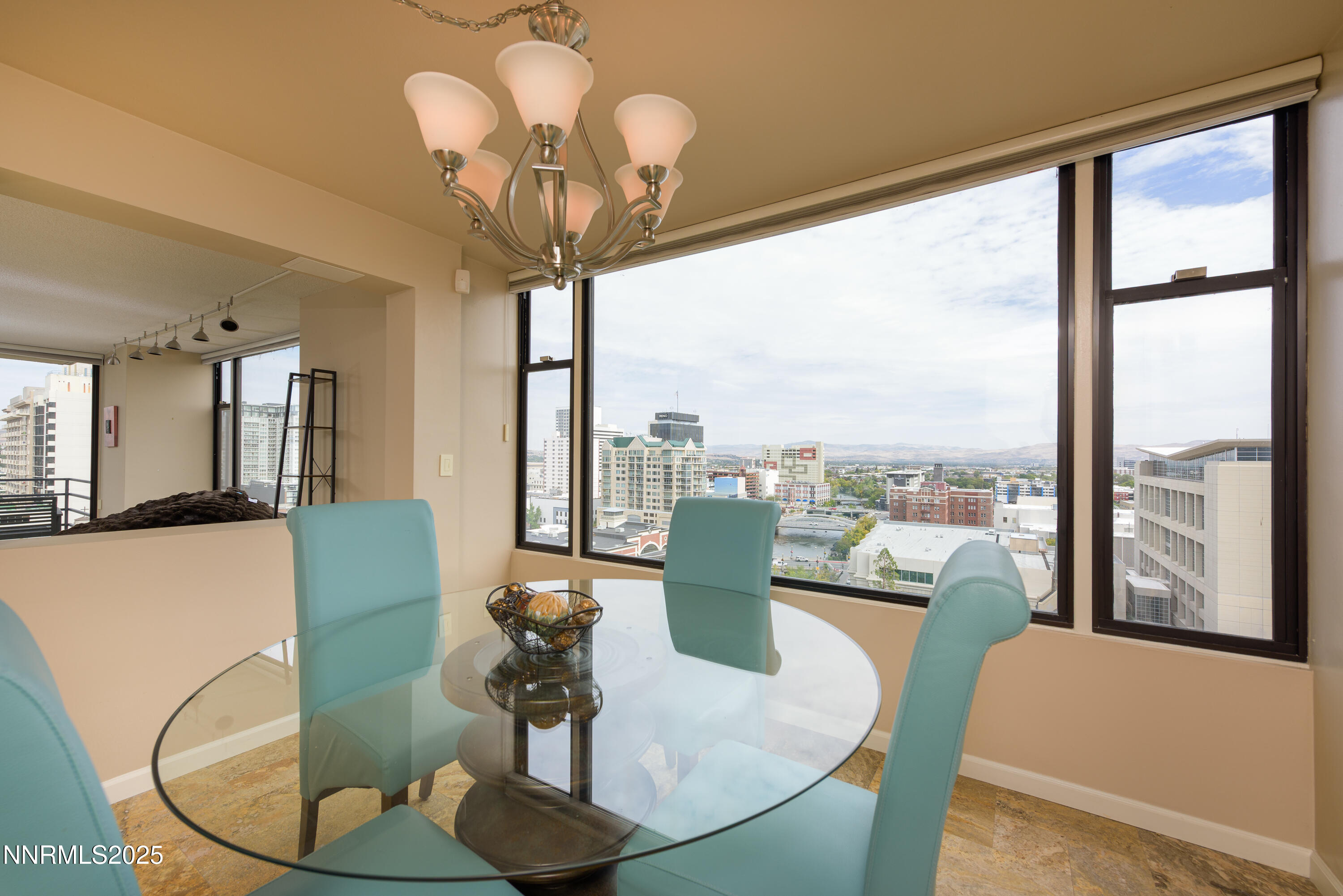 280 Island Avenue, Unit 1602 Reno, NV 89501 - Photo 11 of 35 a dining room with furniture a chandelier and wooden floor