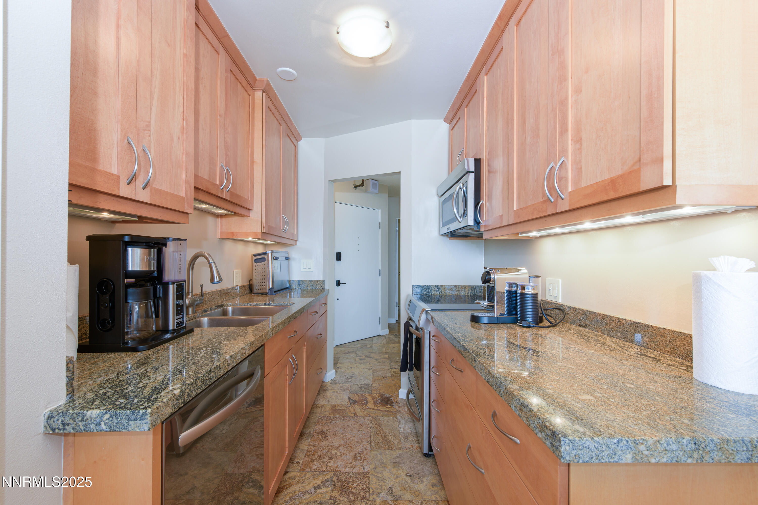 280 Island Avenue, Unit 1602 Reno, NV 89501 - Photo 13 of 35 a kitchen with granite countertop a sink a stove and cabinets