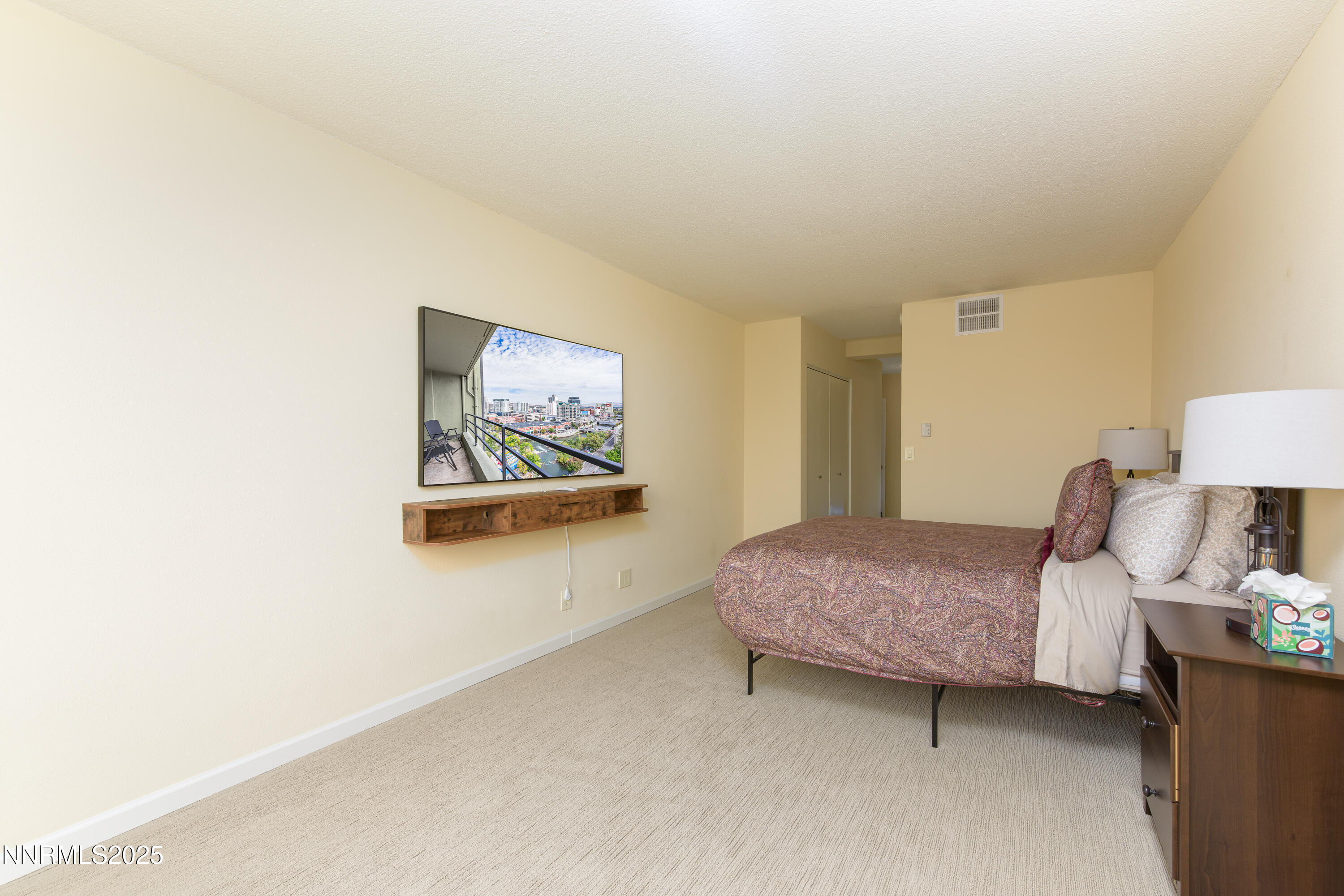 280 Island Avenue, Unit 1602 Reno, NV 89501 - Photo 21 of 35 a bedroom with a bed and a painting on the wall