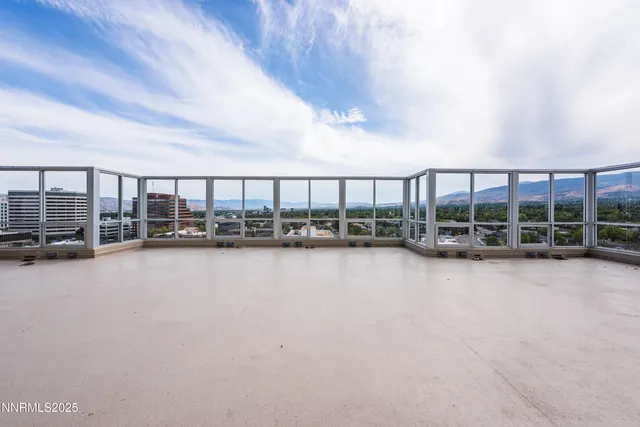 a living room with furniture pool table and a large window