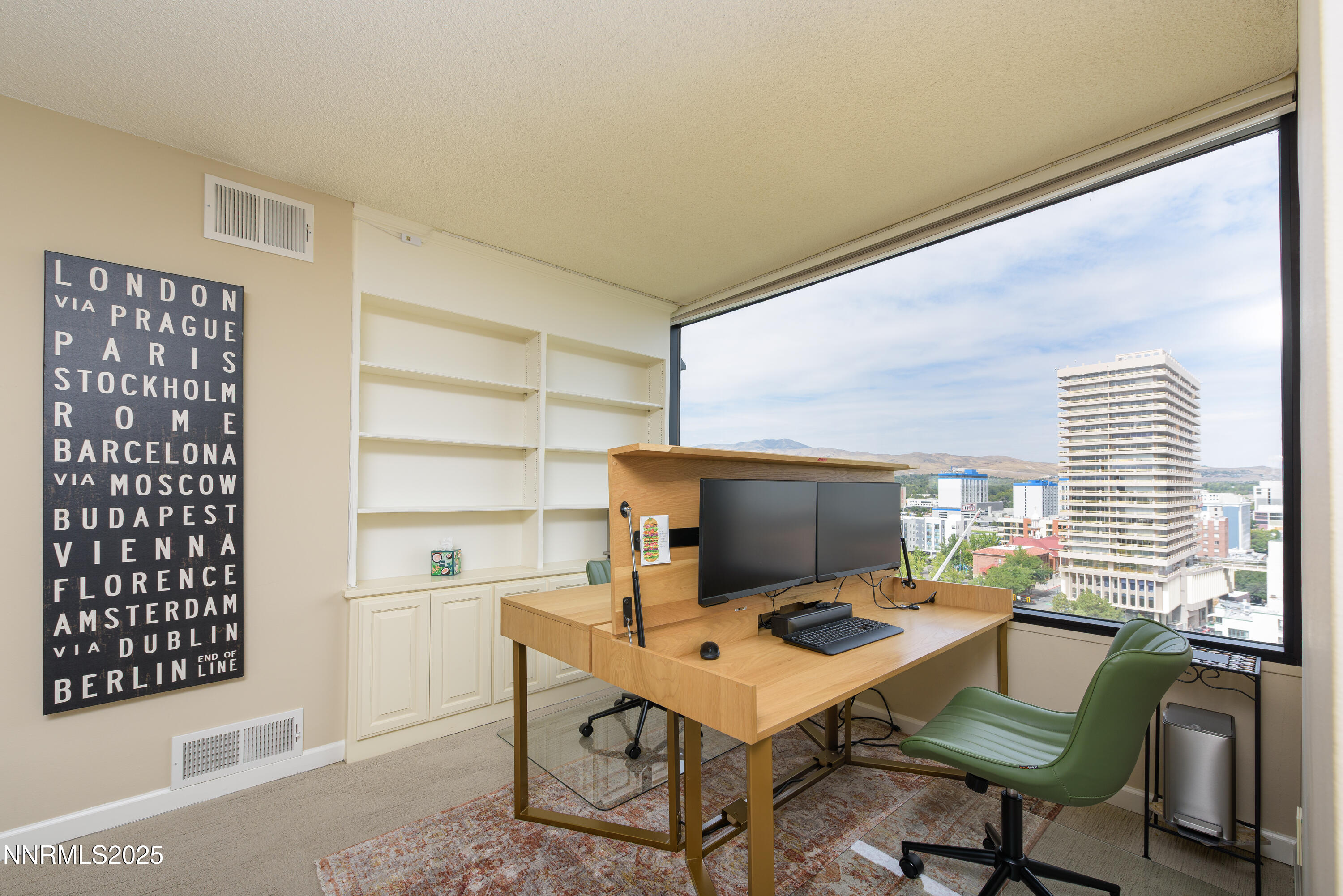 280 Island Avenue, Unit 1602 Reno, NV 89501 - Photo 5 of 35 a view of a workspace with furniture and a window