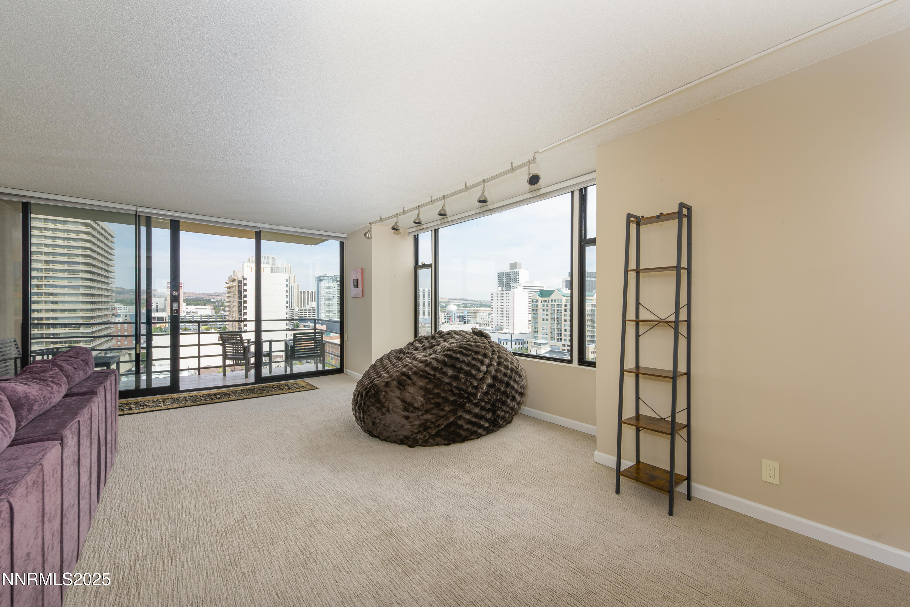 280 Island Avenue, Unit 1602 Reno, NV 89501 - Photo 9 of 35 a room with a large bed and a large window