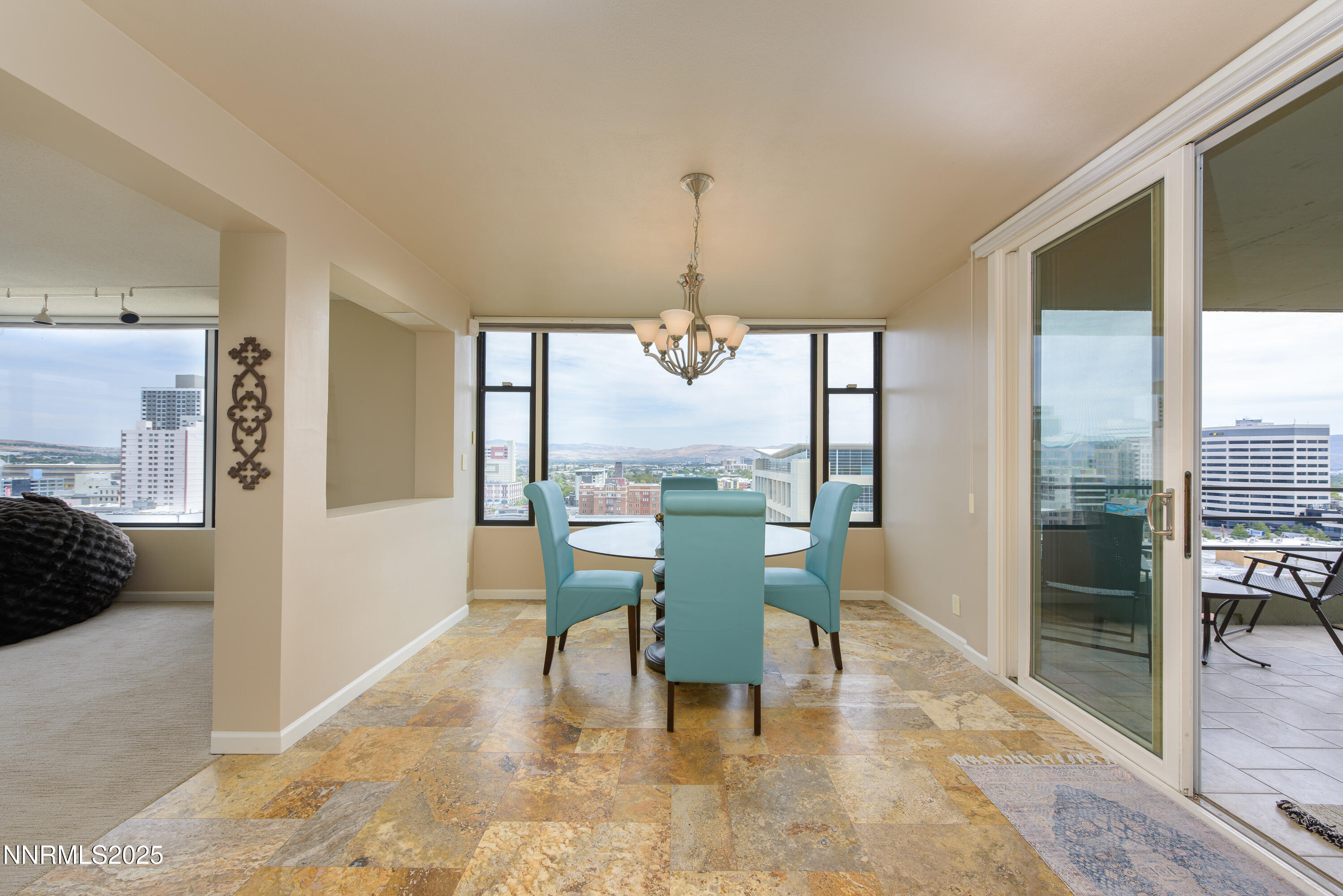 280 Island Avenue, Unit 1602 Reno, NV 89501 - Photo 10 of 35 a dining room with furniture and a floor to ceiling window