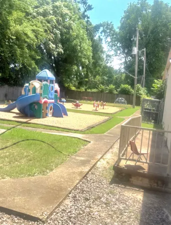 a view of a swimming pool with a yard