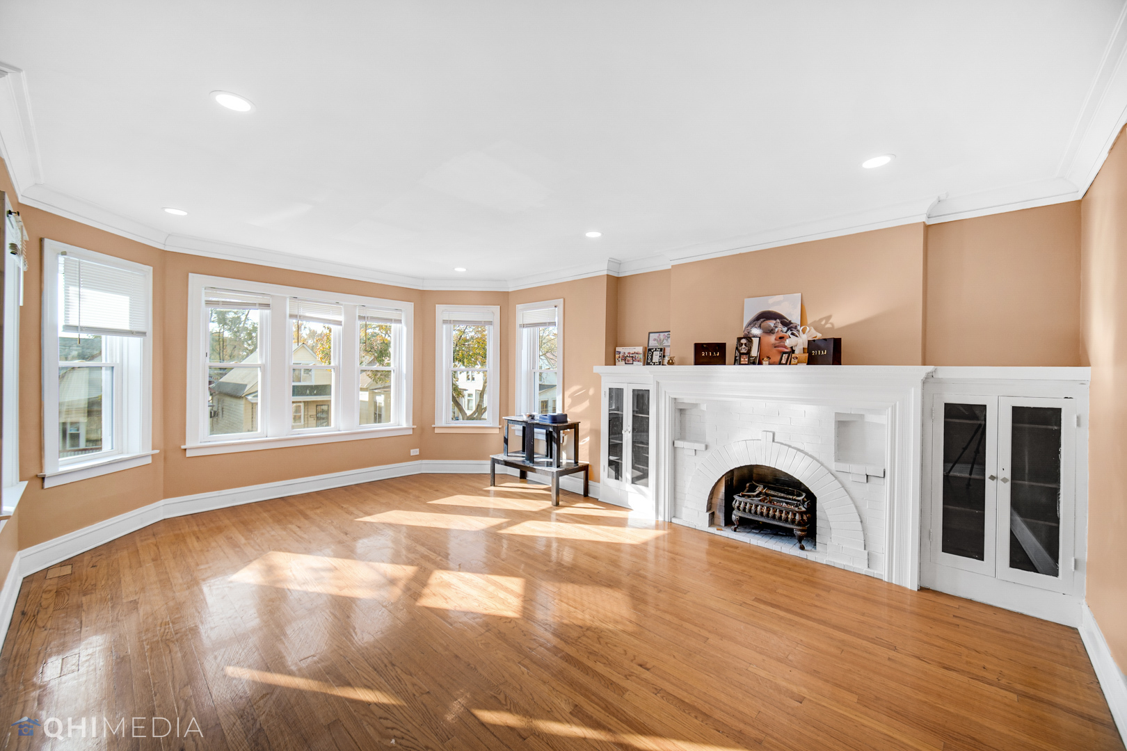 52 West 112th Street Chicago, IL 60628 - Photo 15 of 28 a living room with a fireplace and a large window