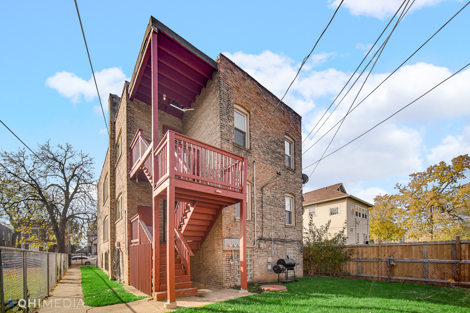 52 West 112th Street Chicago, IL 60628 - Photo 28 of 28 a front view of a house with garden