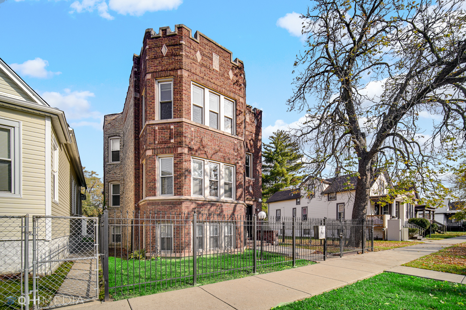 52 West 112th Street Chicago, IL 60628 - Photo 3 of 28 a view of a building with a yard
