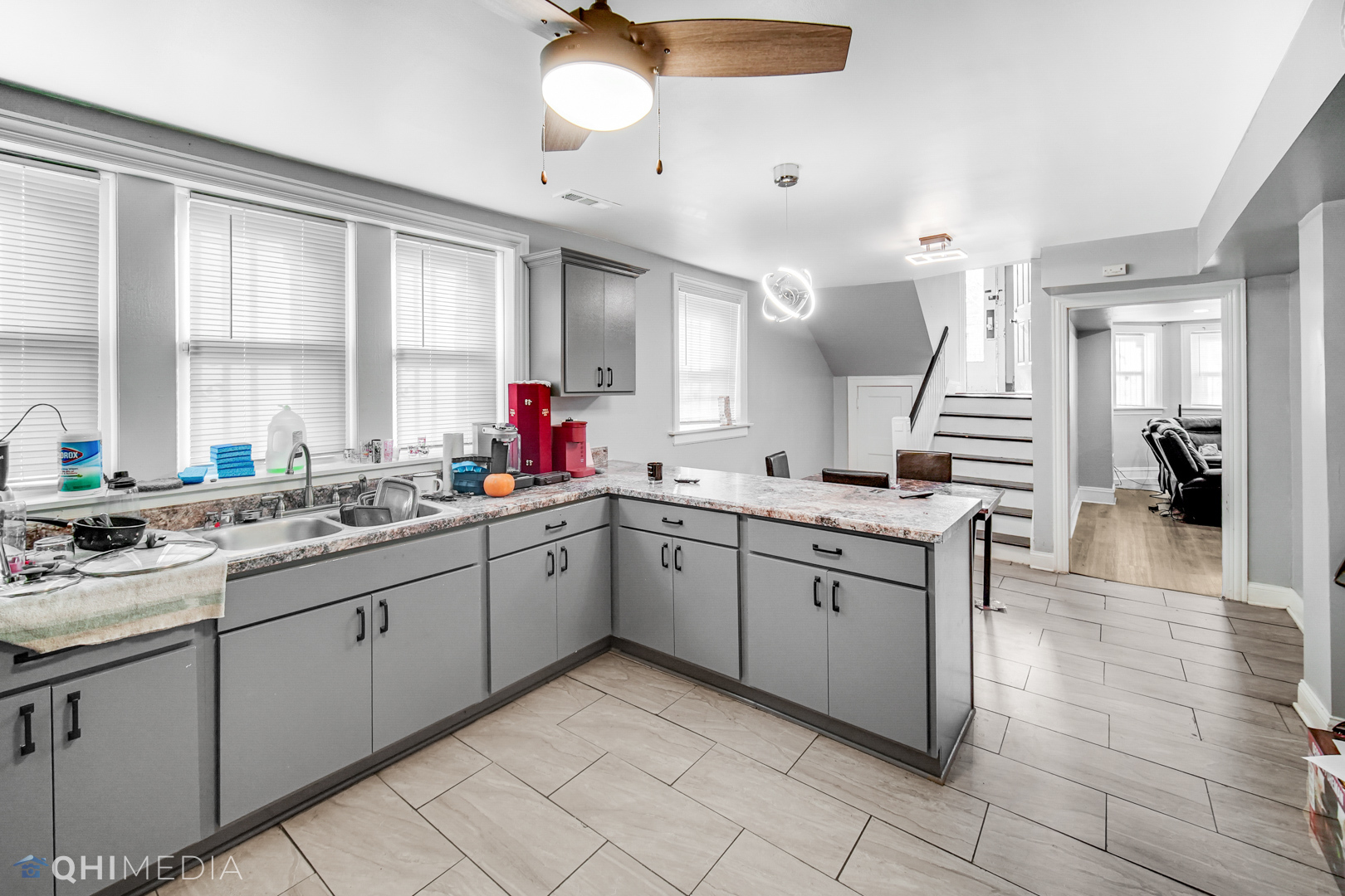 52 West 112th Street Chicago, IL 60628 - Photo 7 of 28 a large kitchen with a sink and cabinets