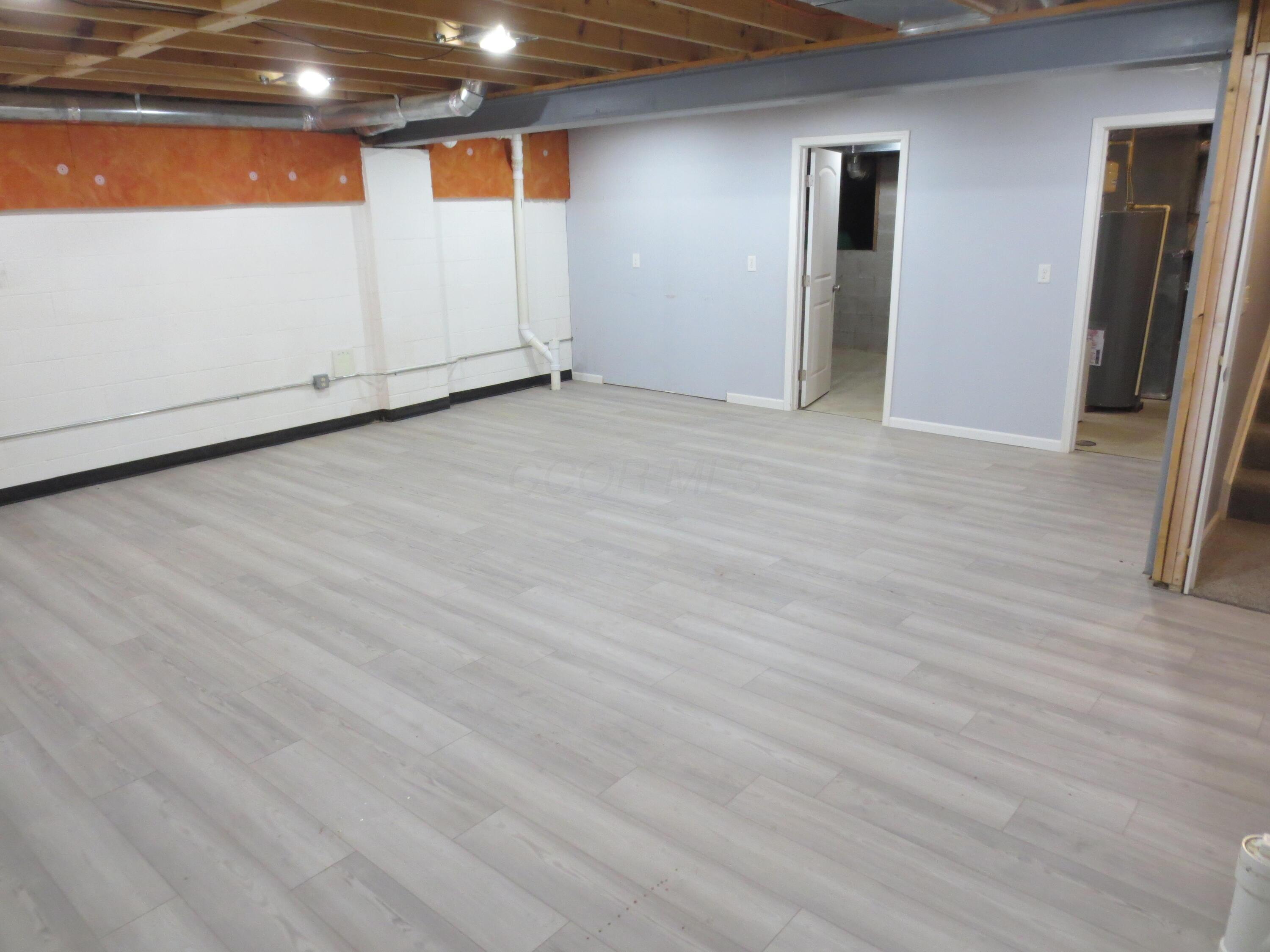 101 Merriston Circle Delaware, OH 43015 - Photo 24 of 34 Basement with extra lighting and finvy flooring.