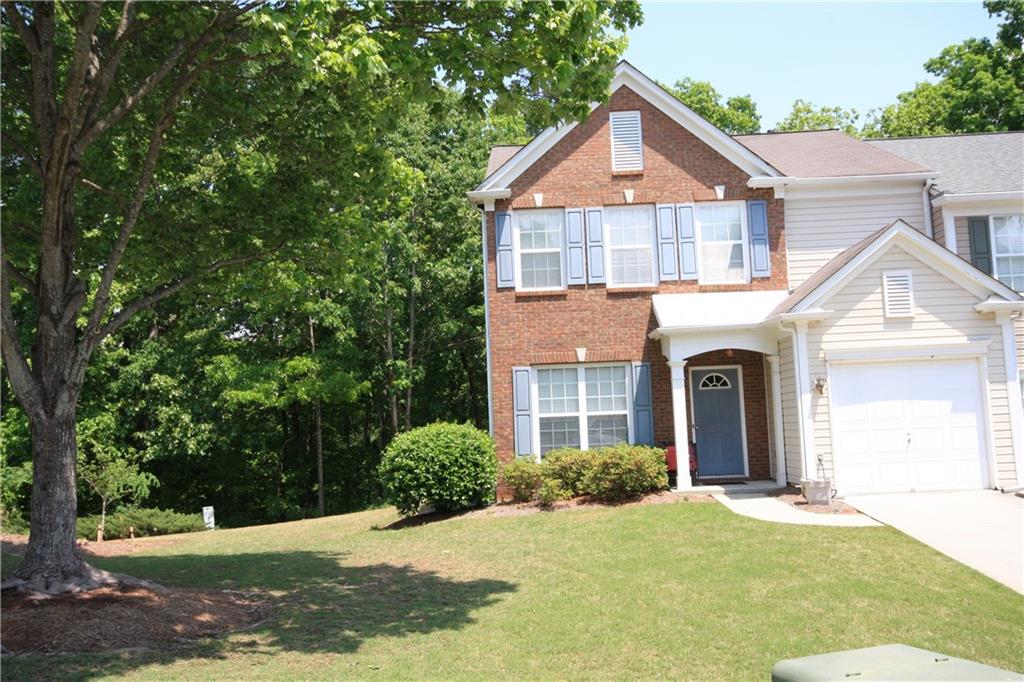 6301 Falling Water Court Roswell, GA 30076 - Photo 1 of 1 a view of a yard in front of a house with large windows