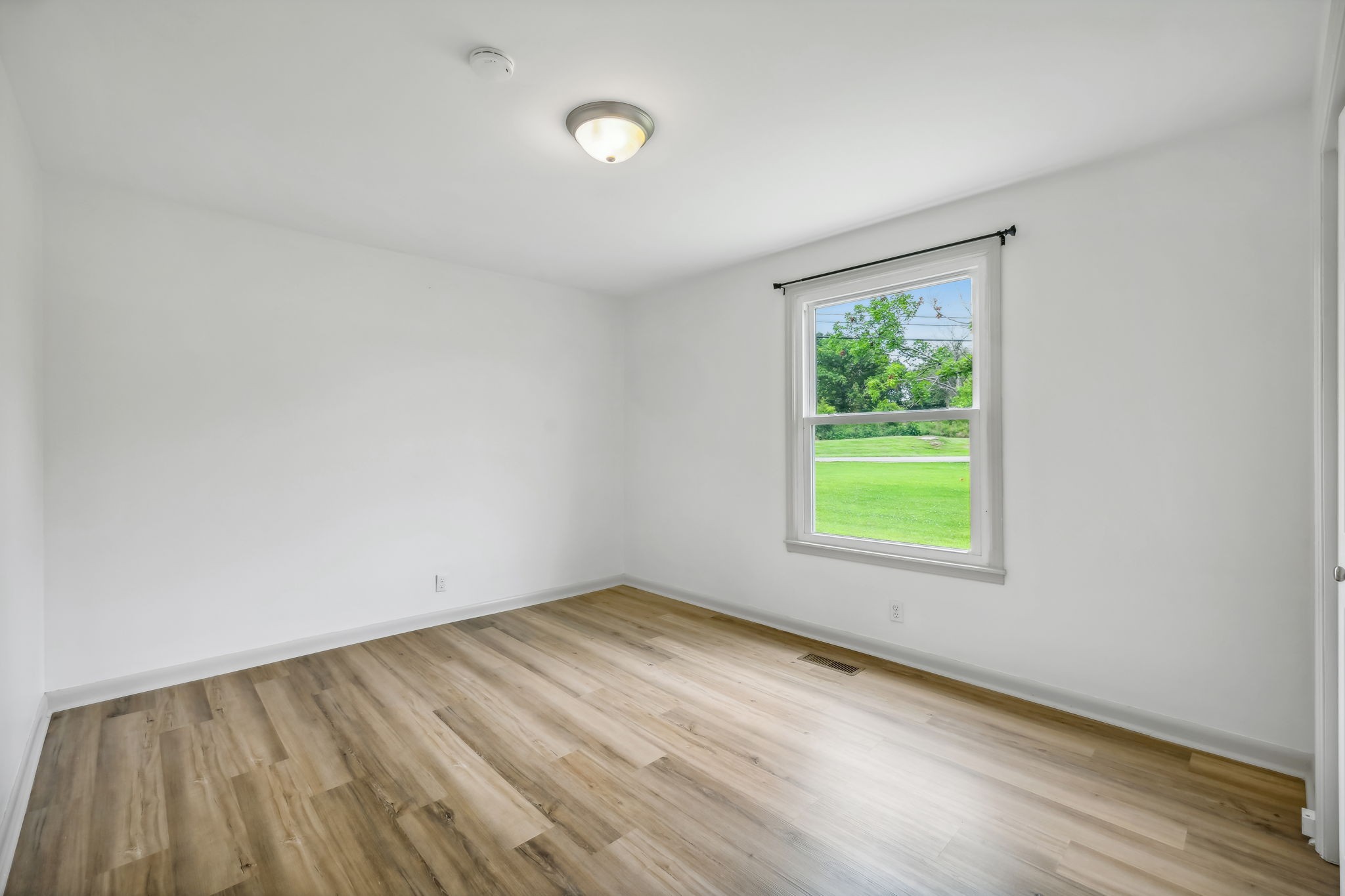 102 Pascal Drive Mount Juliet, TN 37122 - Photo 14 of 41 an empty room with wooden floor and windows