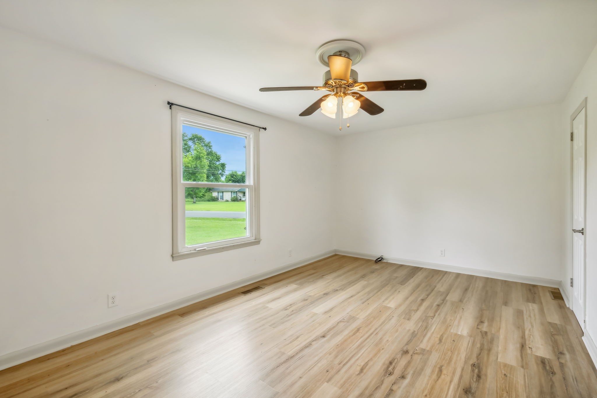 102 Pascal Drive Mount Juliet, TN 37122 - Photo 9 of 41 wooden floor in an empty room with a window