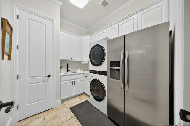 a kitchen with a sink cabinets and window