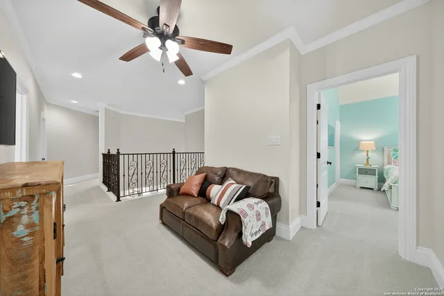 a living room with lots of furniture and clutter