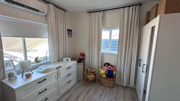 a view of living room with furniture and a window