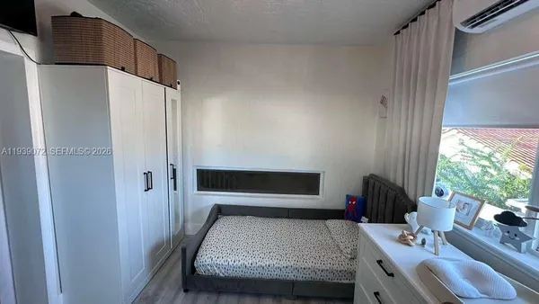 a view of hallway with wooden floor