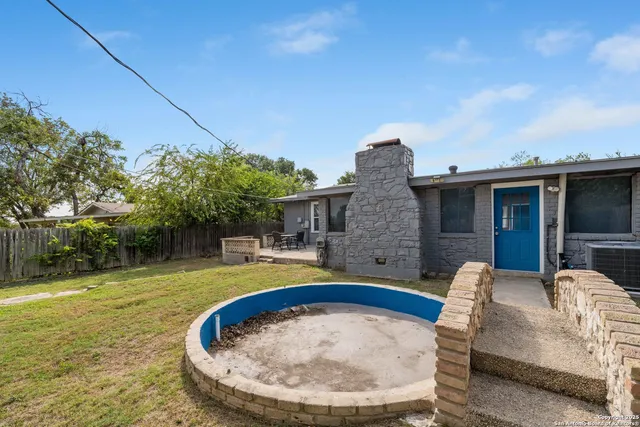 a view of a house with swimming pool