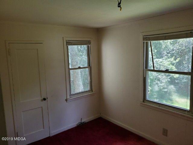 1690 Upper River Road Macon, GA 31211 - Photo 2 of 6 an empty room with windows