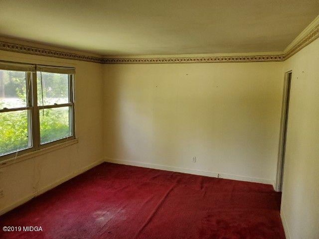 1690 Upper River Road Macon, GA 31211 - Photo 3 of 6 a view of an empty room with a window