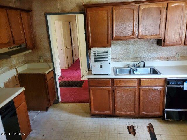 1690 Upper River Road Macon, GA 31211 - Photo 5 of 6 a kitchen with stainless steel appliances granite countertop a refrigerator and a stove