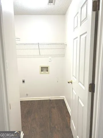 a bathroom with a tub mirror and toilet