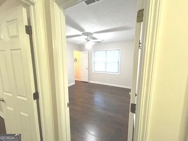 a kitchen with stainless steel appliances a refrigerator and a stove top oven