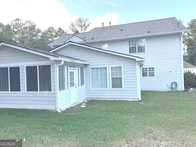 a kitchen with a stove oven and white cabinets