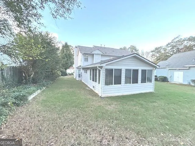 a bathroom with a granite countertop sink mirror vanity and toilet