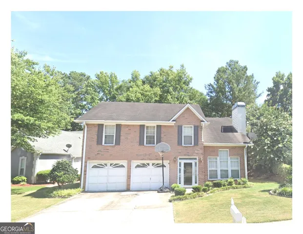 a bathroom with a double vanity sink mirror and shower