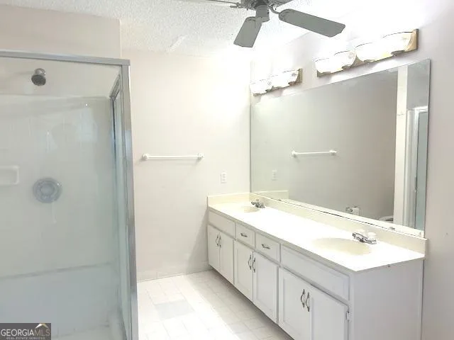 a white bath tub sitting next to a white sink