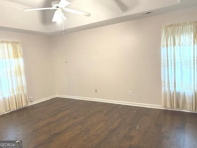 a view of wooden floor in an empty room