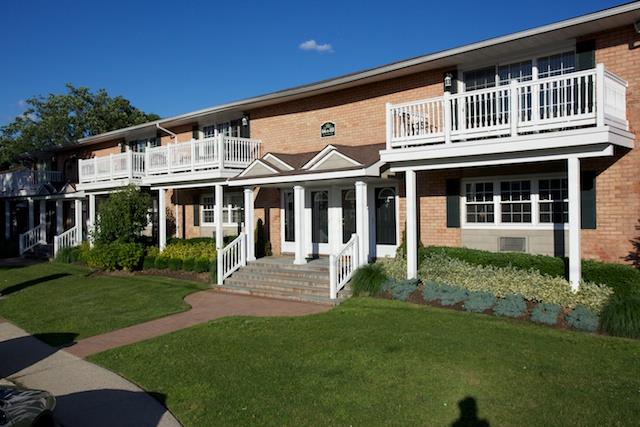 81 Claire Court, Unit 81 West Babylon, NY 11704 - Photo 1 of 1 a front view of a house with a garden