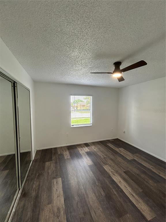 7808 Osteen Road New Port Richey, FL 34653 - Photo 11 of 20 wooden floor in an empty room