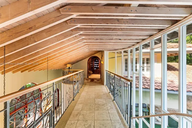 a view of balcony with wooden floor