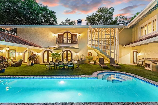 a view of swimming pool with outdoor seating