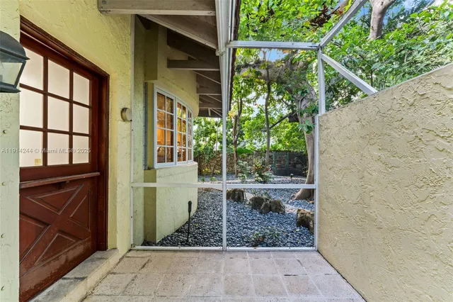 a view of a door and chair in the balcony
