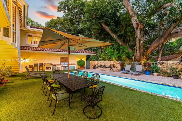 a view of swimming pool with outdoor seating