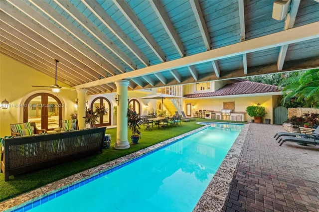 an outdoor space with furniture and garden