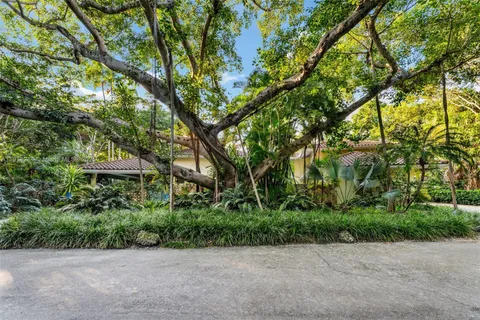 a backyard of a house with lots of green space