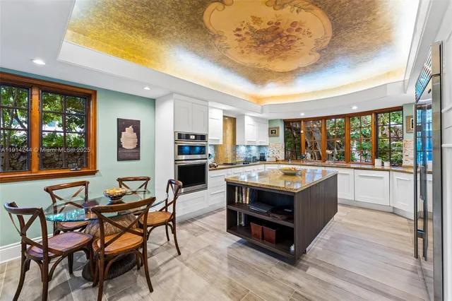 a view of a kitchen counter space and wooden floor
