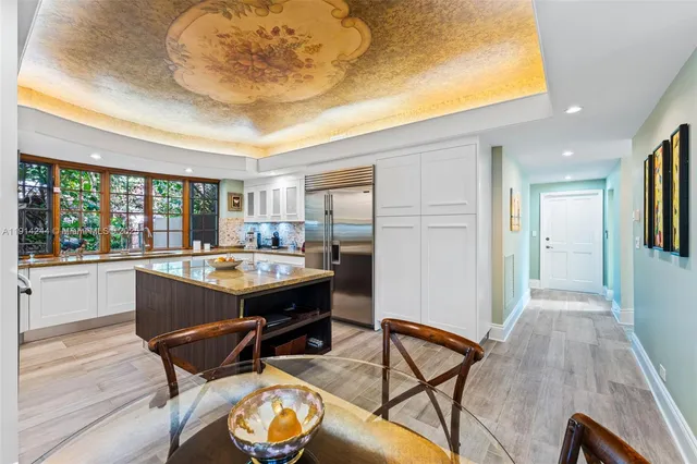 a view of a kitchen and dining room