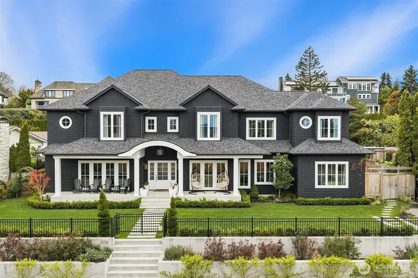 a front view of a house with a garden