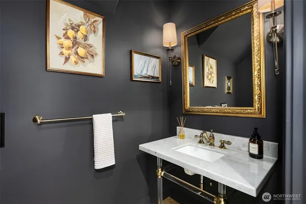 a bathroom with a sink vanity and a mirror