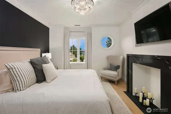 a bedroom with a bed and a television