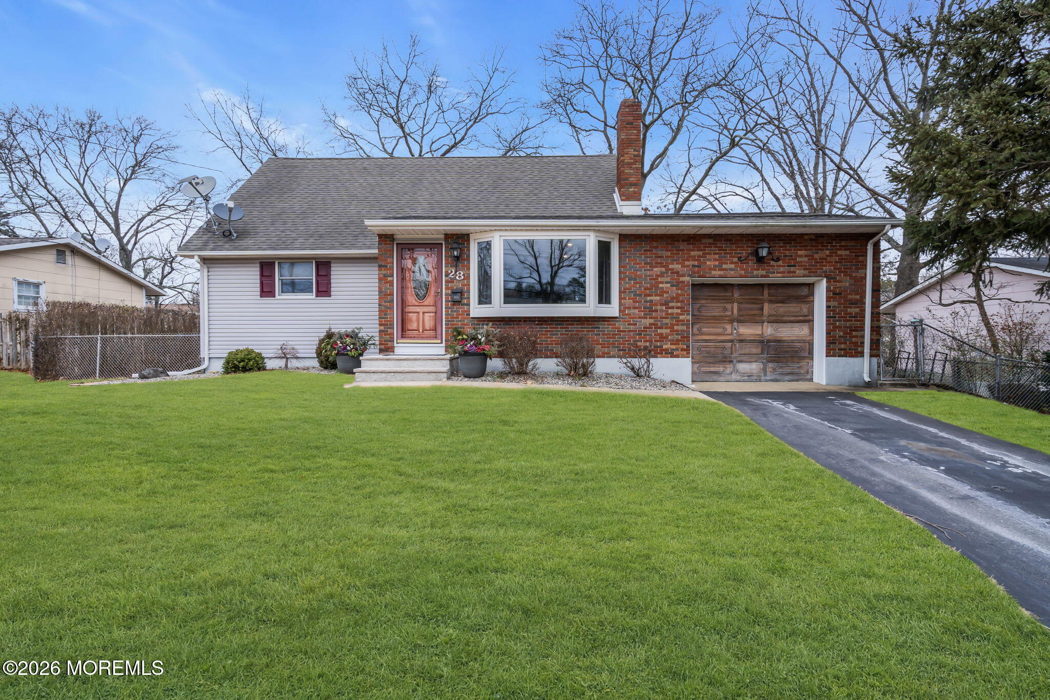 28 Oregon Avenue Jackson, NJ 08527 - Photo 2 of 33 a front view of a house with a yard and trees